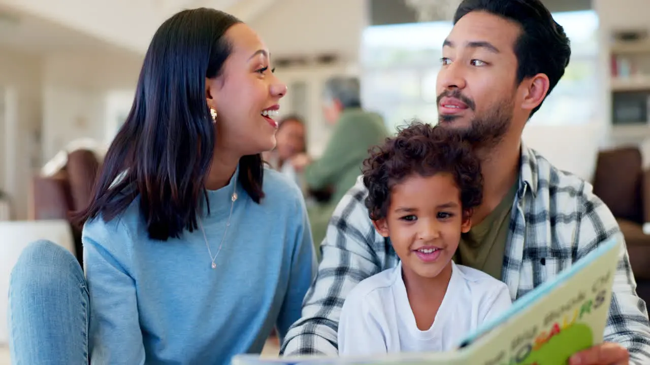 Happy dad mom and child reading book in home