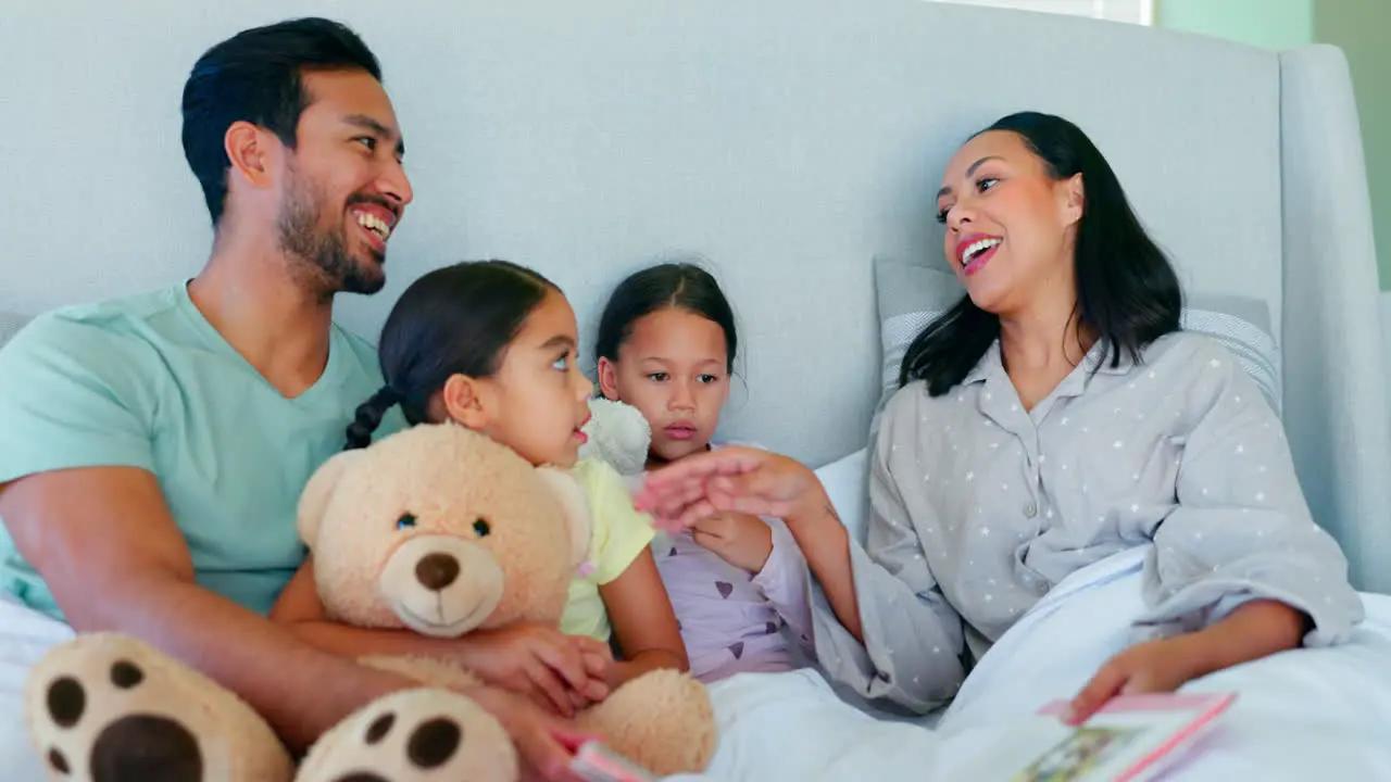 Bed happy family and parents reading