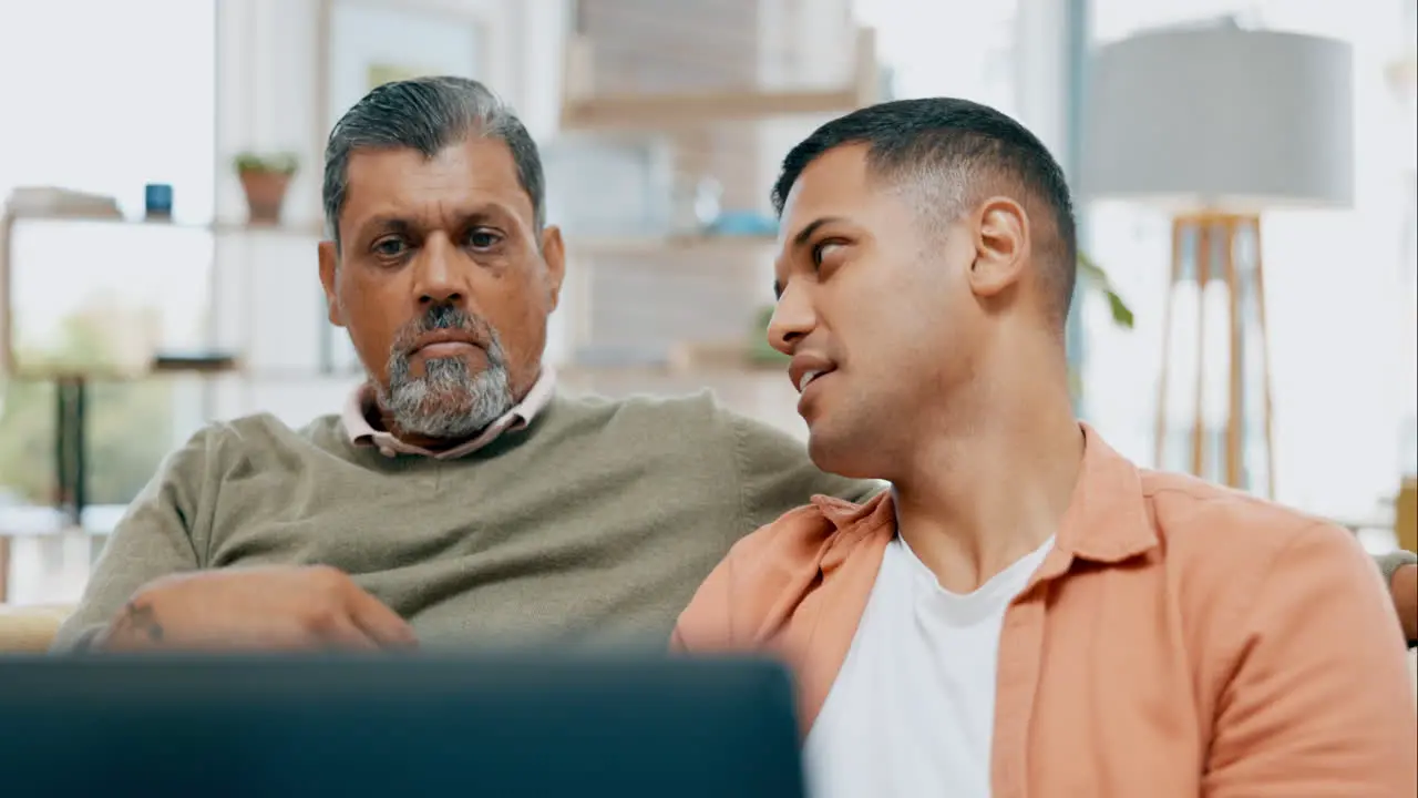 Senior father son and laptop on sofa with talk