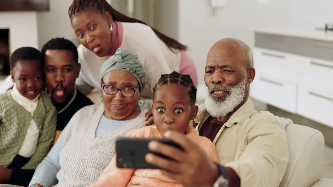 Black family selfie and funny face on sofa