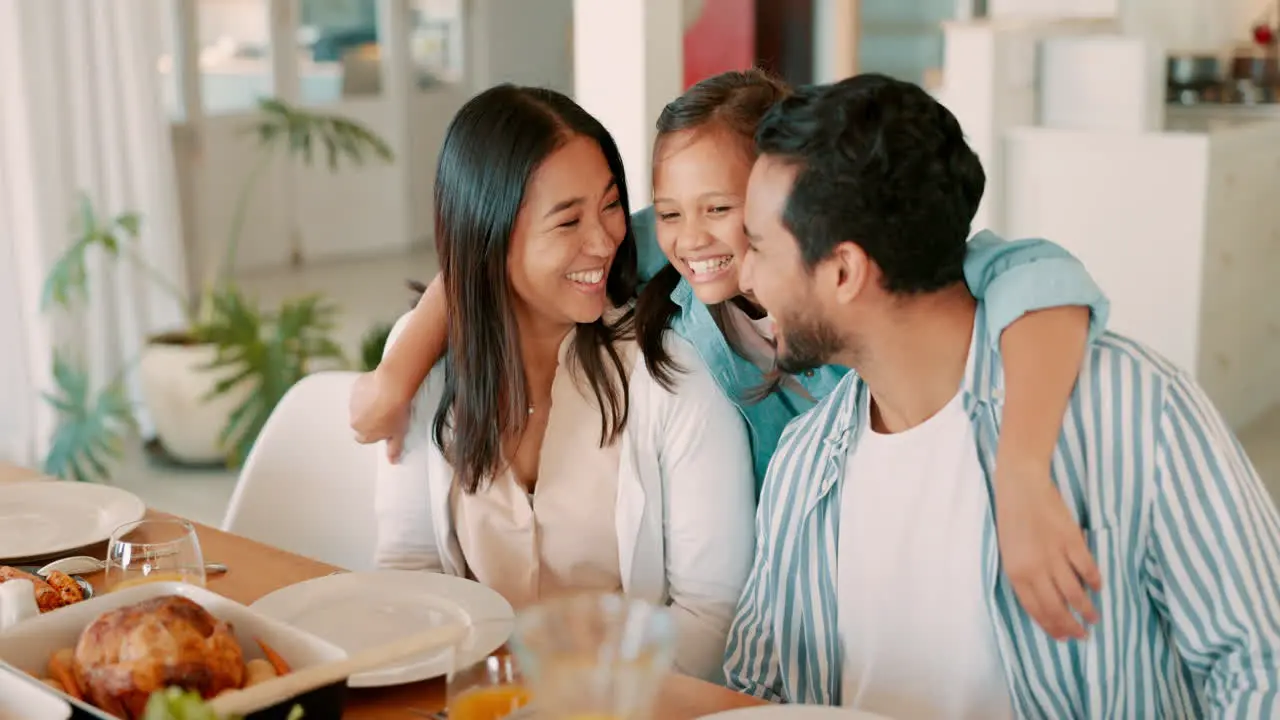 Family dinner girl hug parents