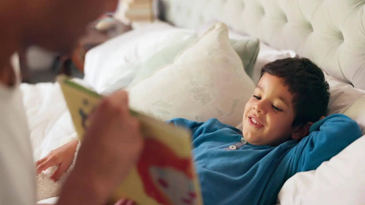 Dad son and bed with book