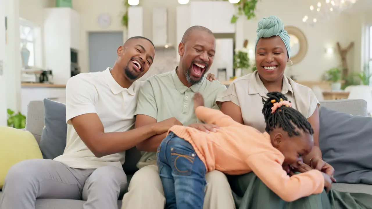 Black family laughing and parents with child