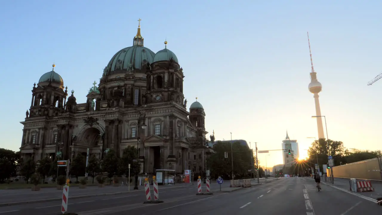 Cyclist Passing the Berlin Cathedral at Sunrise