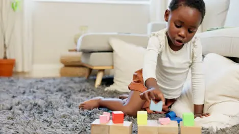 Black girl building blocks