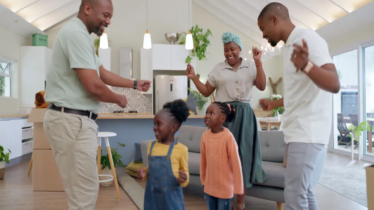 Moving boxes and parents with kids dancing