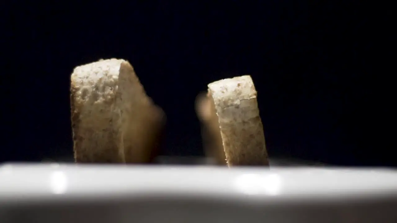 Slow motion close up shot of toast pooping up out the toaster