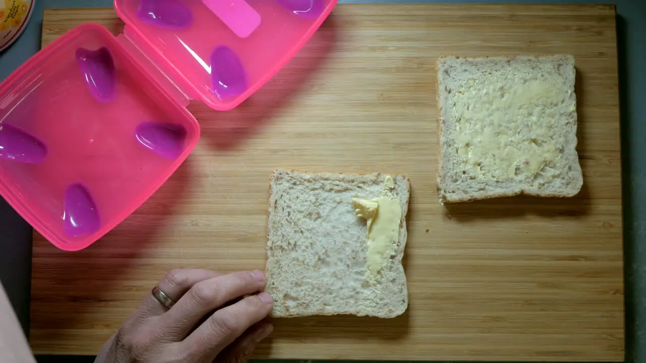 Margarine being spread onto wholegrain bread