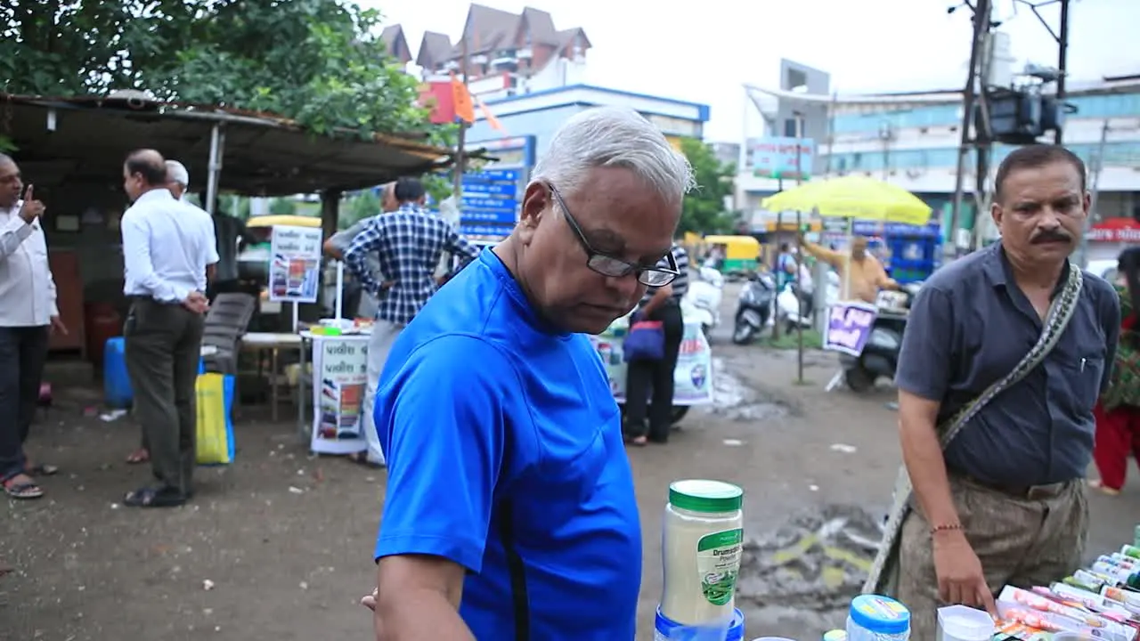 local vender showing best herbal product to customers close shoot of local market