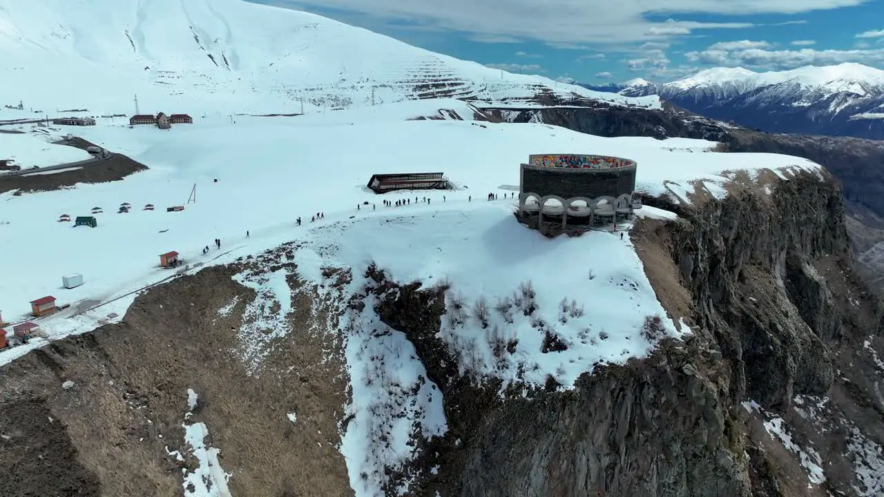 Russian Georgian Friendship Monument On Georgian Military Road Near Gudauri Georgia aerial drone shot