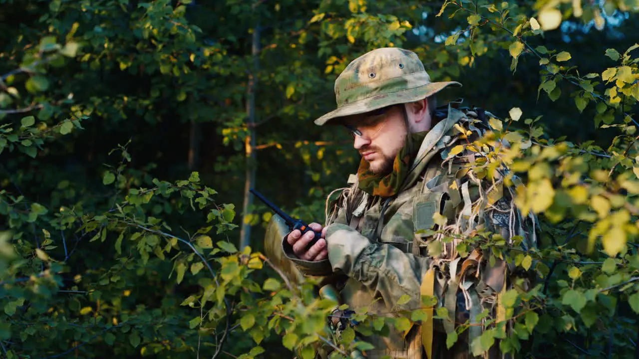 A soldier talks on the radio