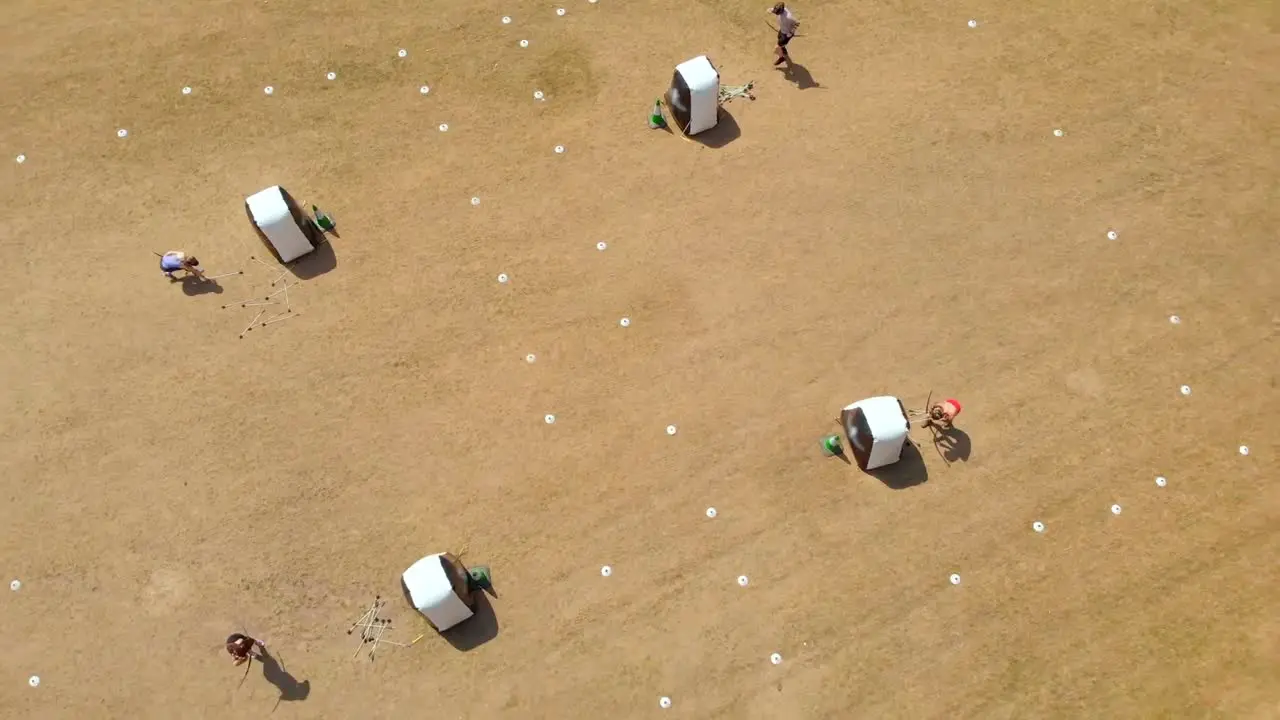 Aerial view of archers practicing archery at boot camp 4k