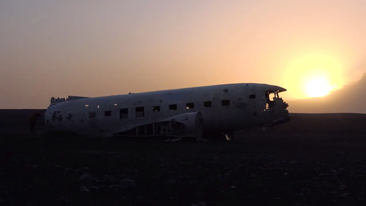 Silhouette of a crashed US Navy DC-3 on the black sands of Solheimasandur Iceland