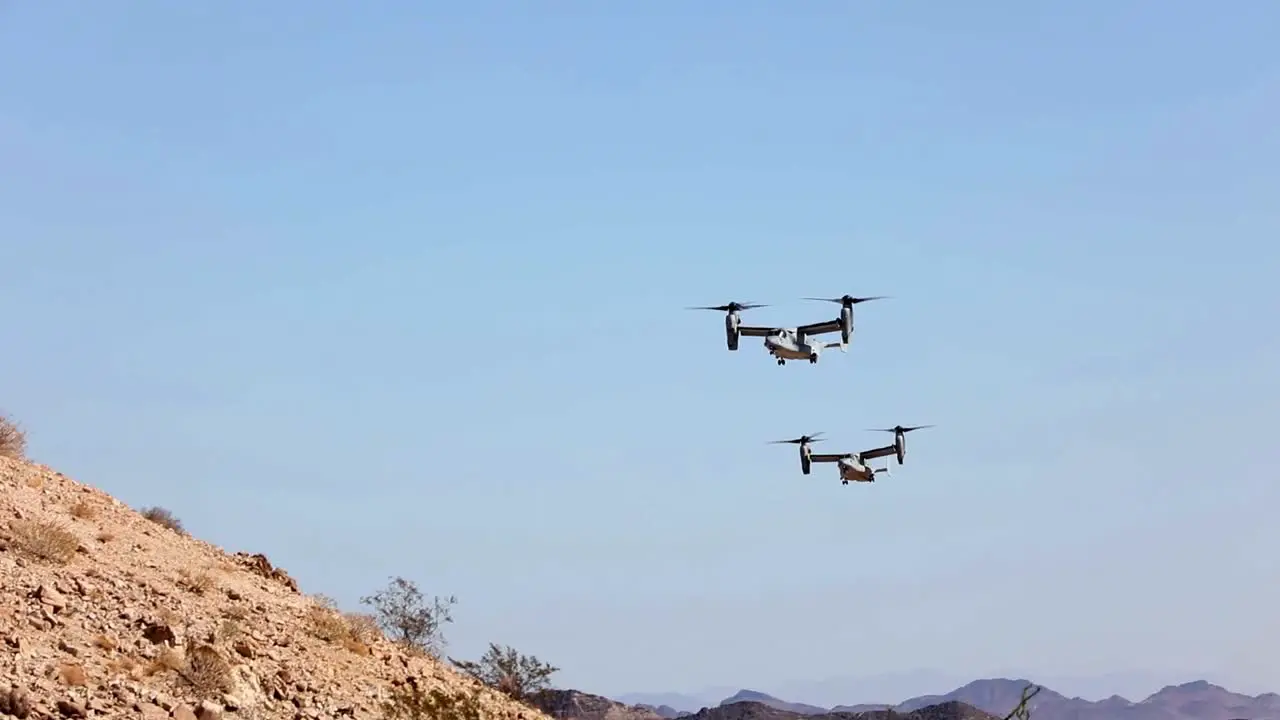 Us Marines V-22 Osprey Vertical Take Off And Landing Vtol Aircraft Drop Defensive Decoy Flares Over The Desert