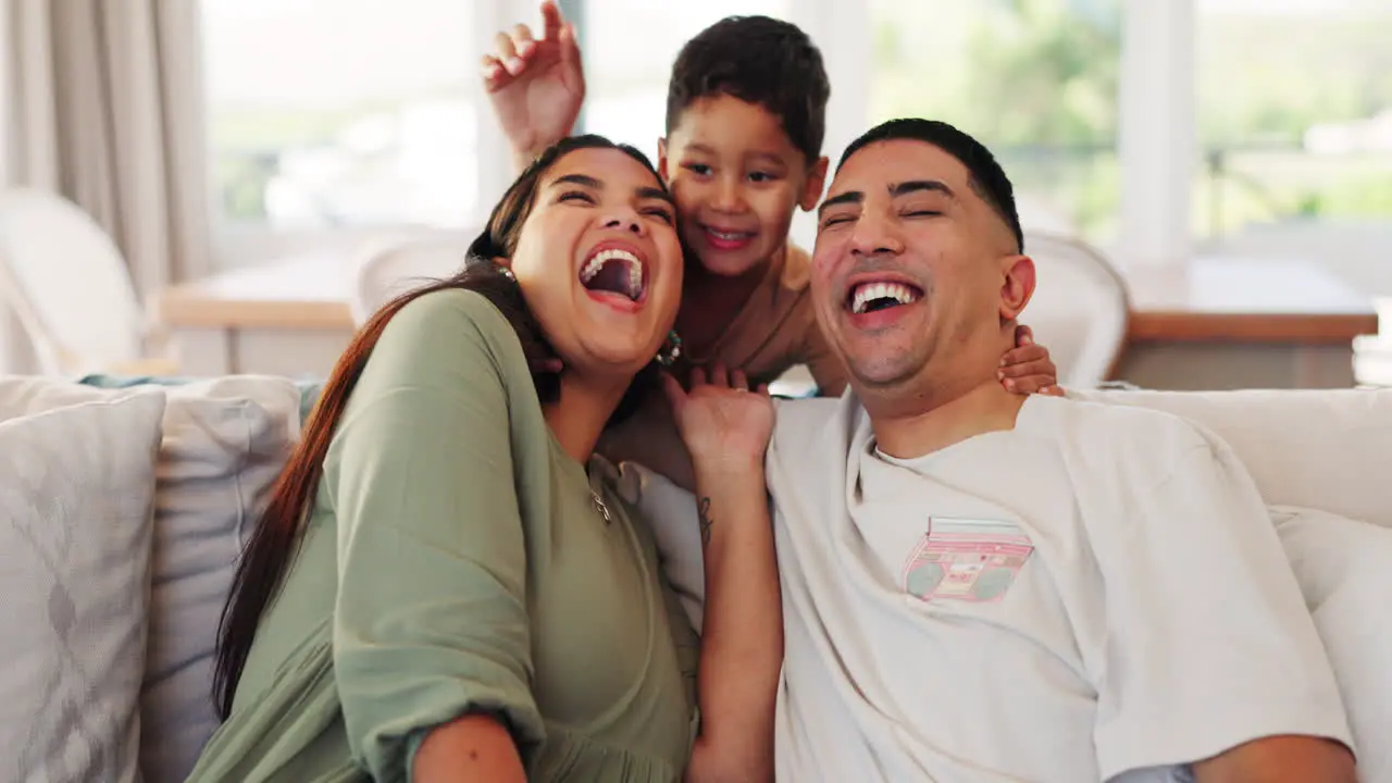 Happy family sofa and boy child surprise hug