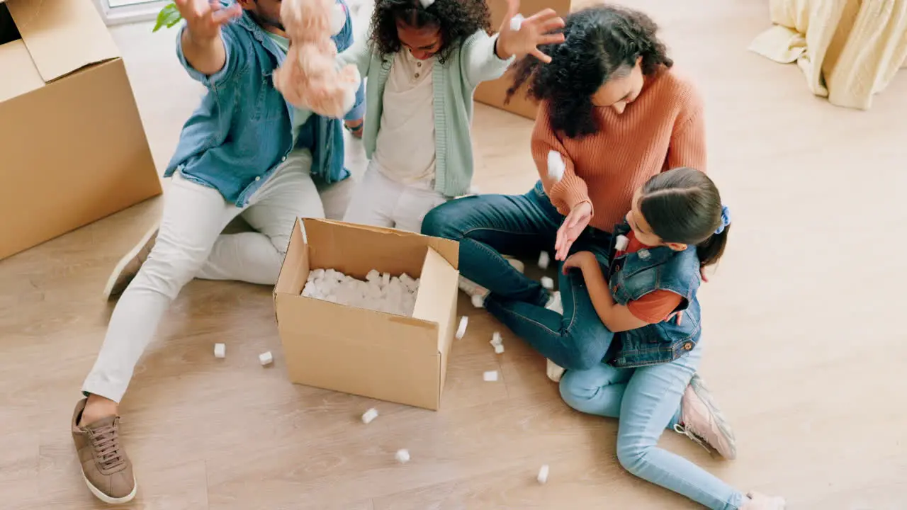 Happy family unboxing and real estate in new home