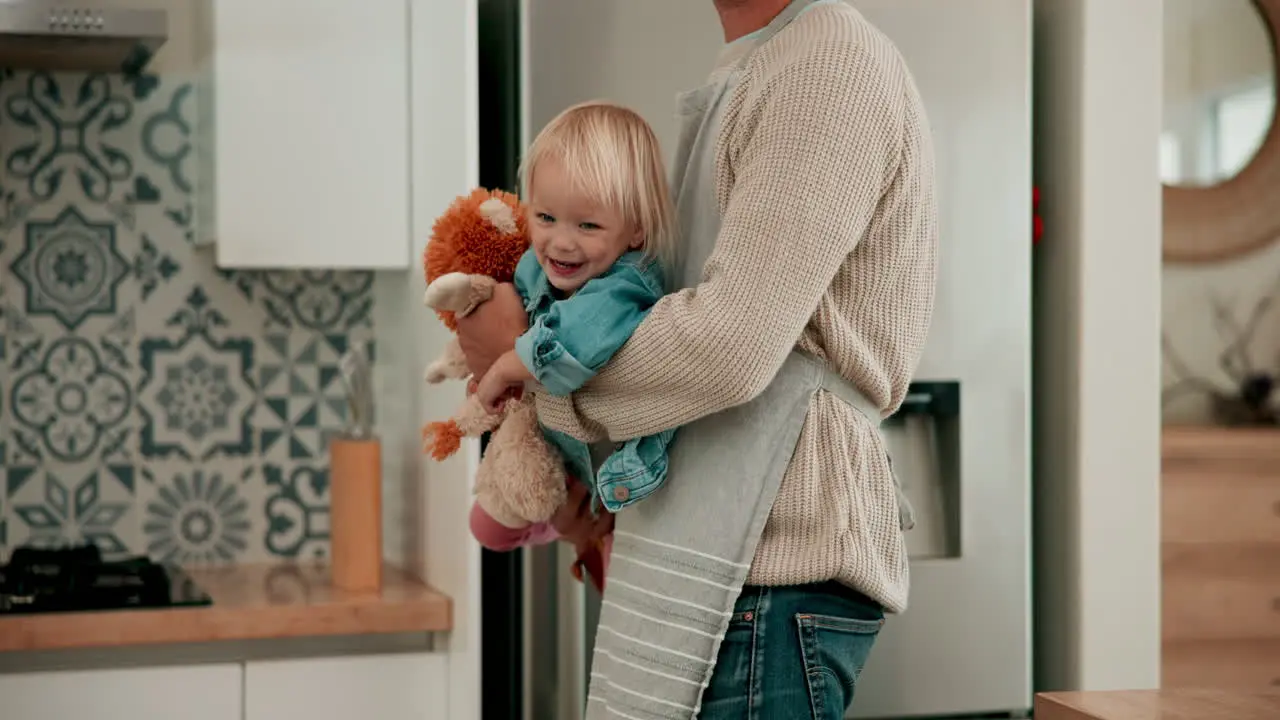 Smile kitchen or parent playing with baby to