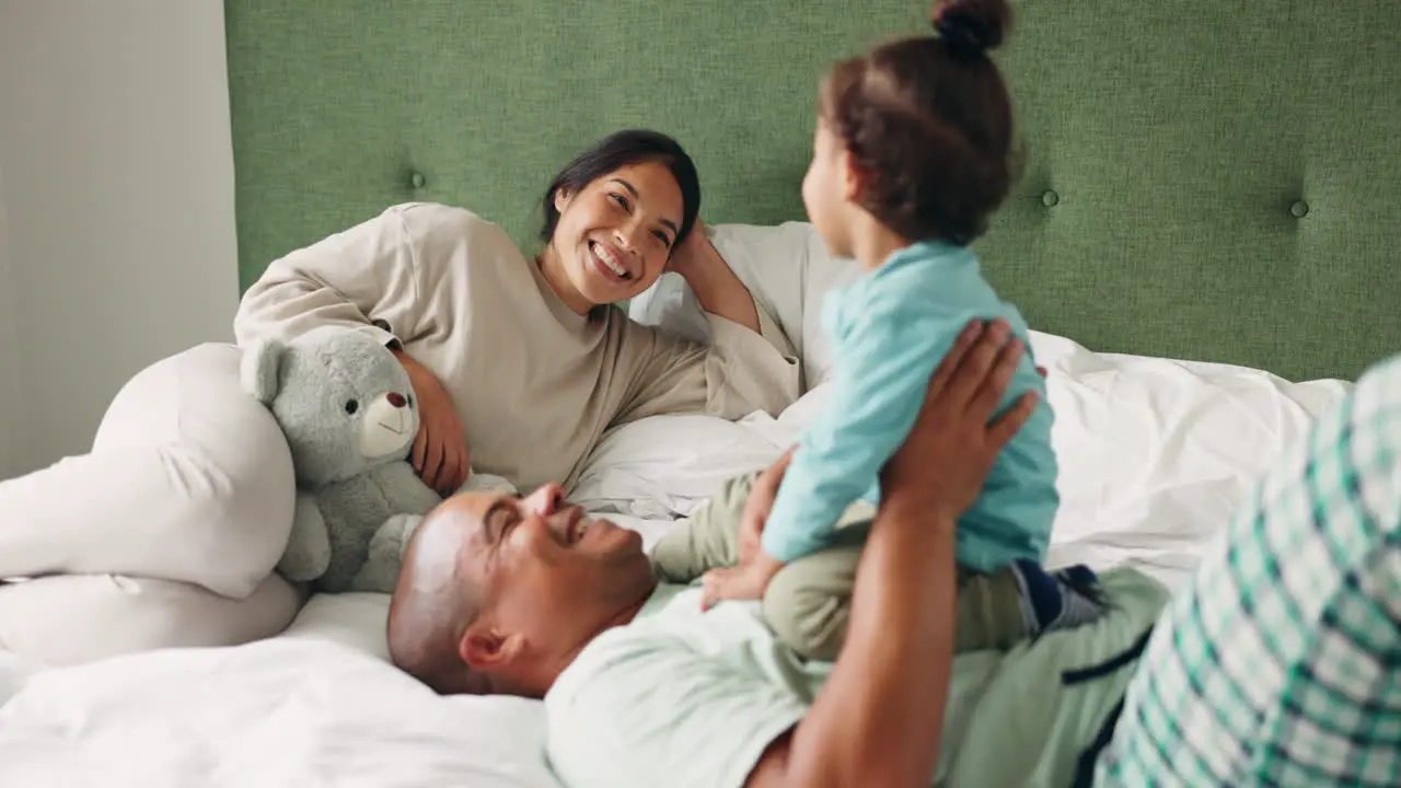 Bed happy family and child with fun