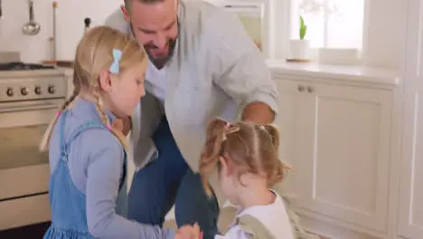 Kitchen children and dad dance for happy bonding