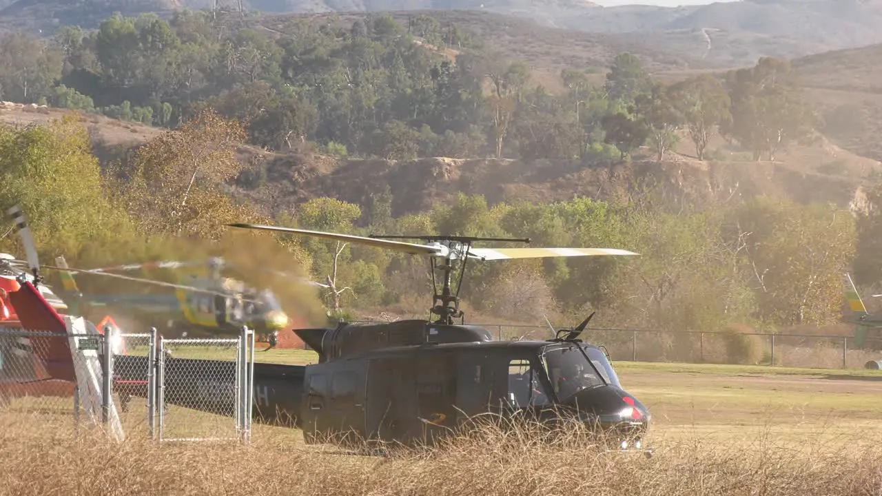 helicopter flying over empty field