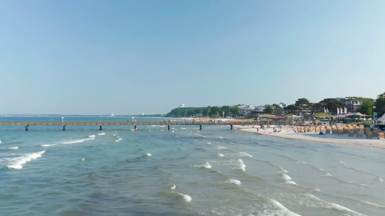 Scenic summertime travel destination beach in Scharbeutz Germany Baltic sea sunny day dolly in