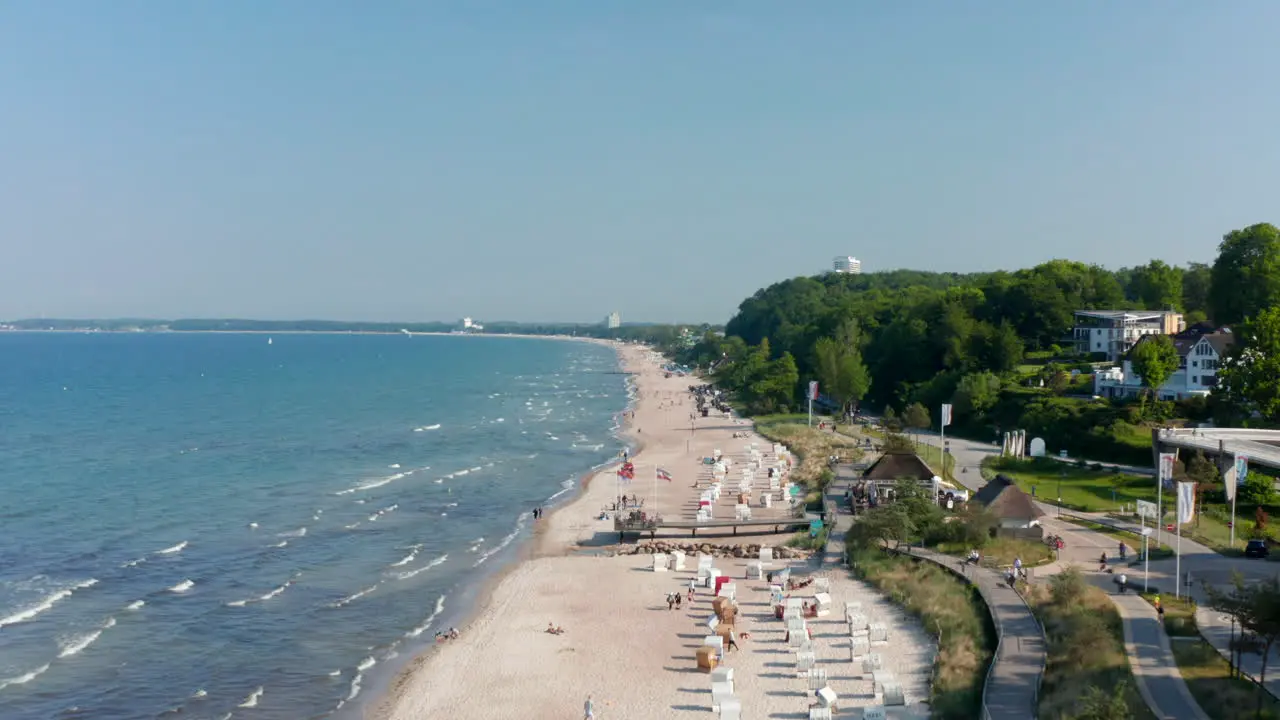 Baltic sea beach shoreline aerial drone view in Scharbeutz Germany forward day