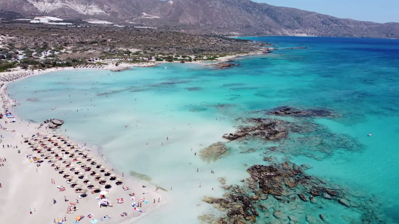 Stunning aerial over touristic Elafonissi beach and clear Mediterranean Crete