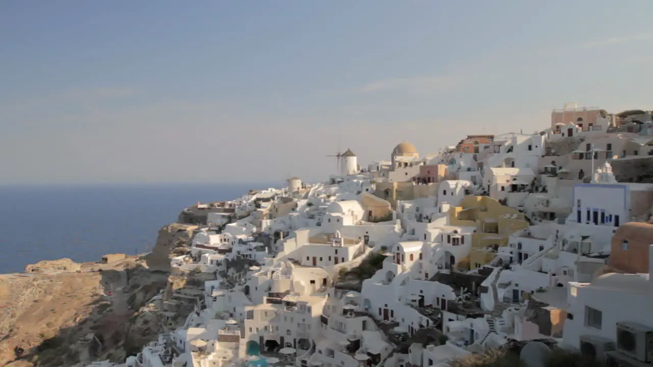 View of holiday homes and villas in the traditional cycladic architecture village of Oia in Santorini Greece