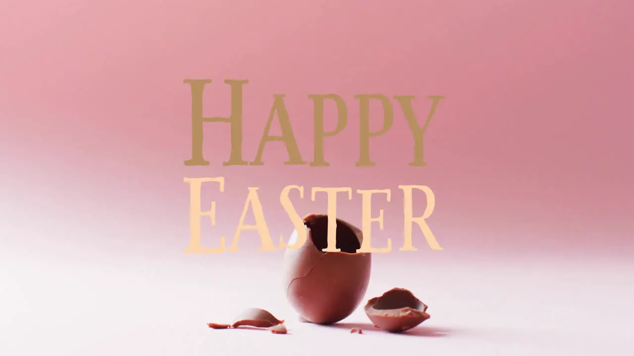 Animation of happy easter text over cracked chocolate easter egg on pink background