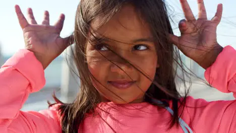 Ocean childhood and face of girl with hands