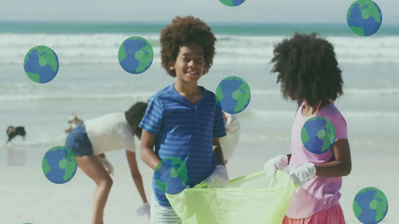 Animation of globes over happy african american family picking waste on sunny beach