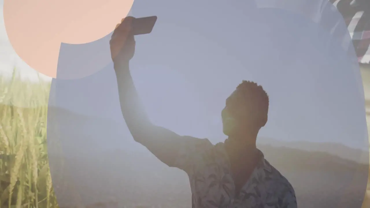 Animation of frame over happy african american man taking selfie