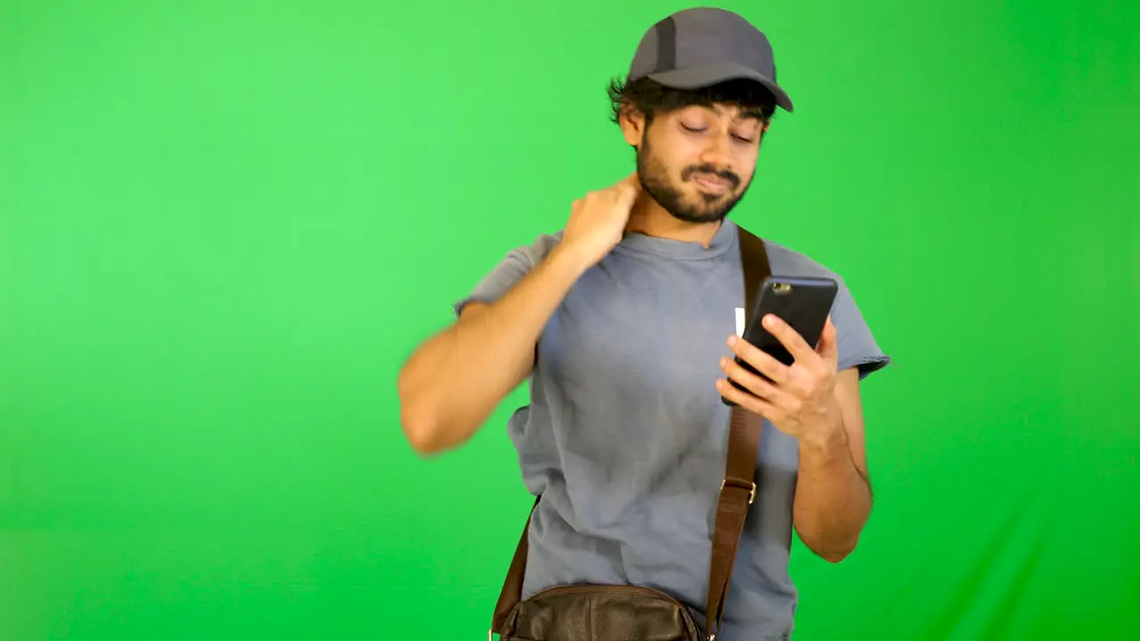 indian tourist try to find the way on road with green background green screen