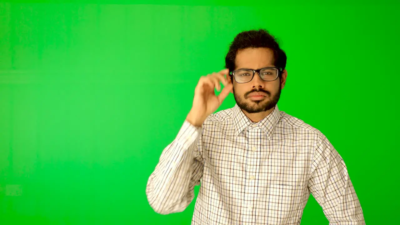 Indian guy express emotion with green background green screen