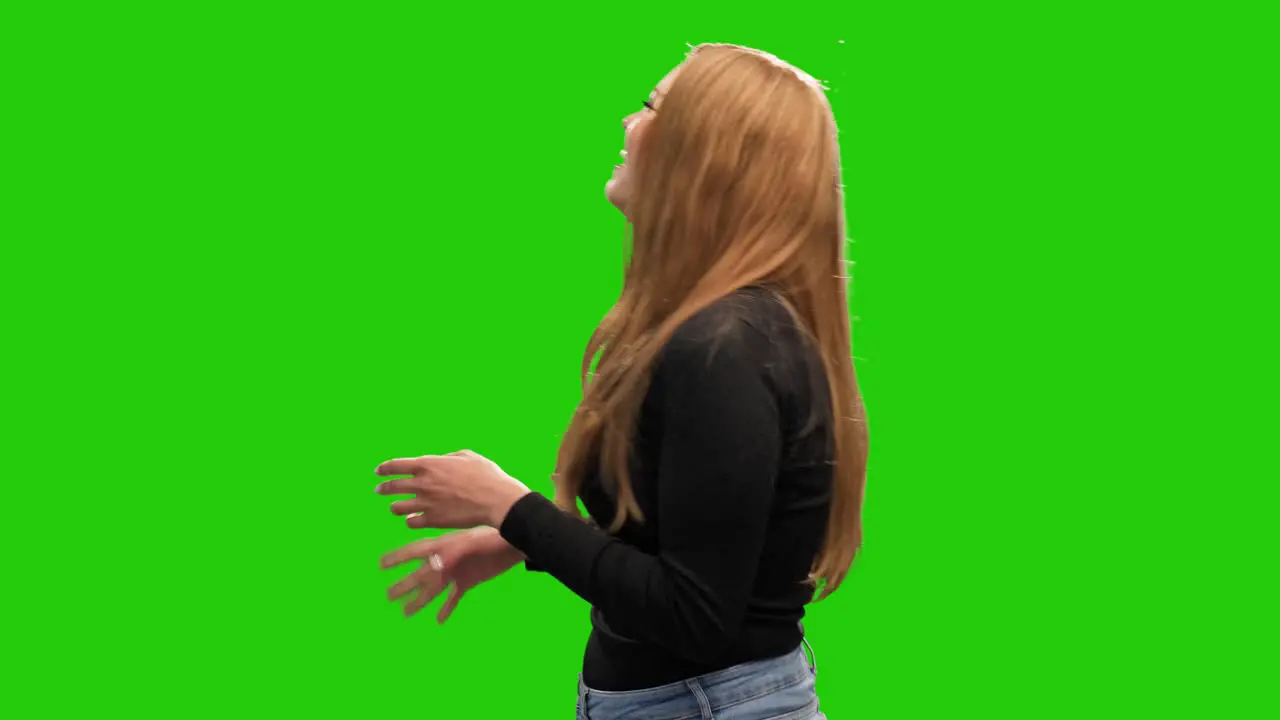 Cute long haired blonde woman laughing on green screen