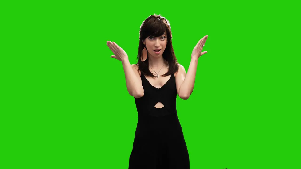 Portrait of adorable slim woman surprised on green screen