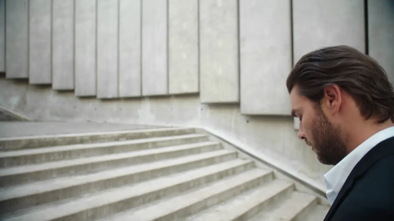 Business man working with documents in city Male entrepreneur walking up stairs