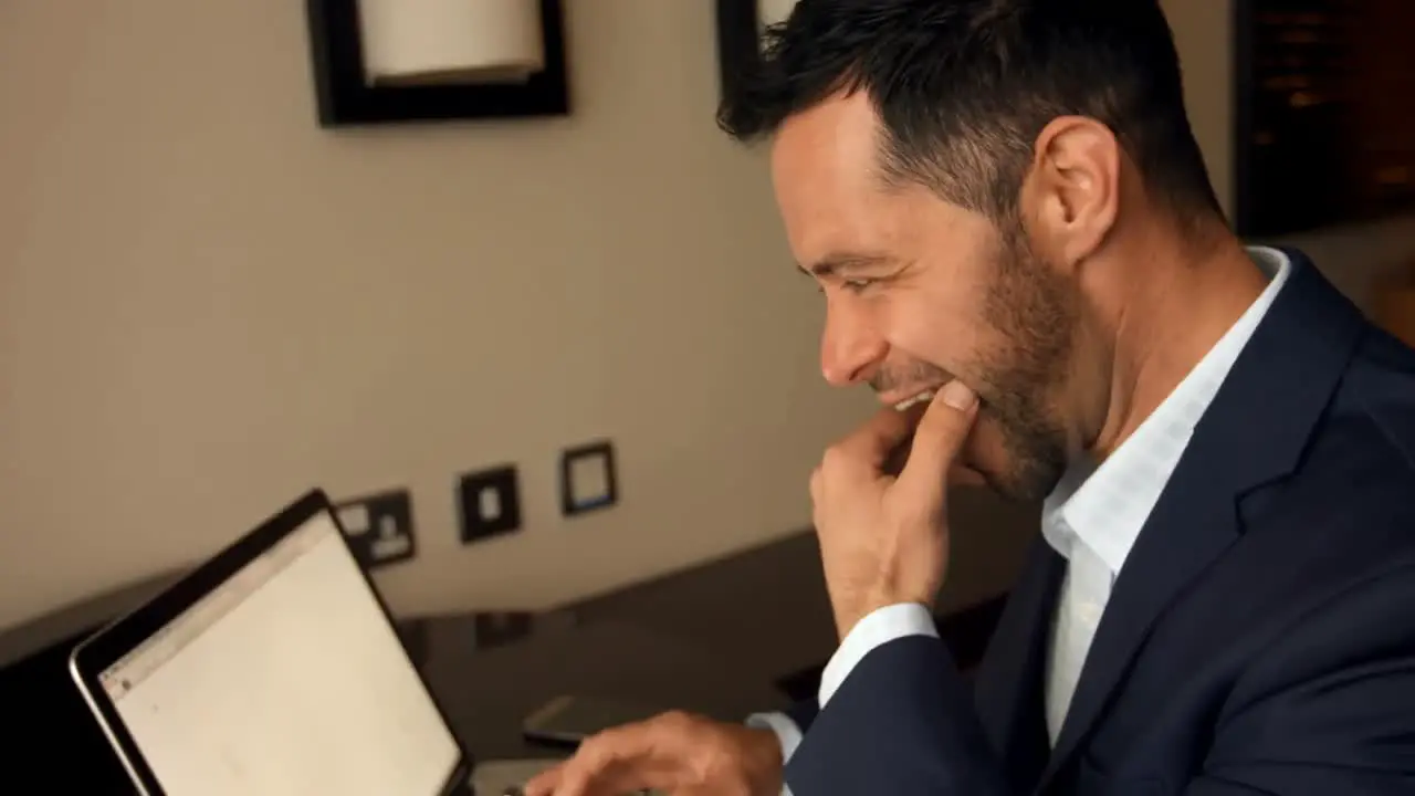 Businessman working on laptop 4k