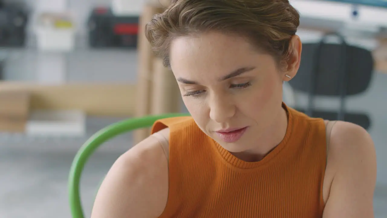 Close Up Of Businesswoman In Office Working At Desk