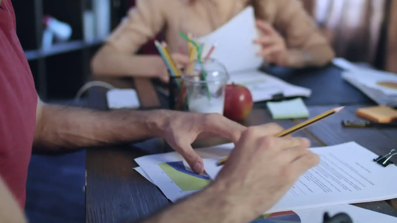 People hands at business meeting Partners reading contract before signing