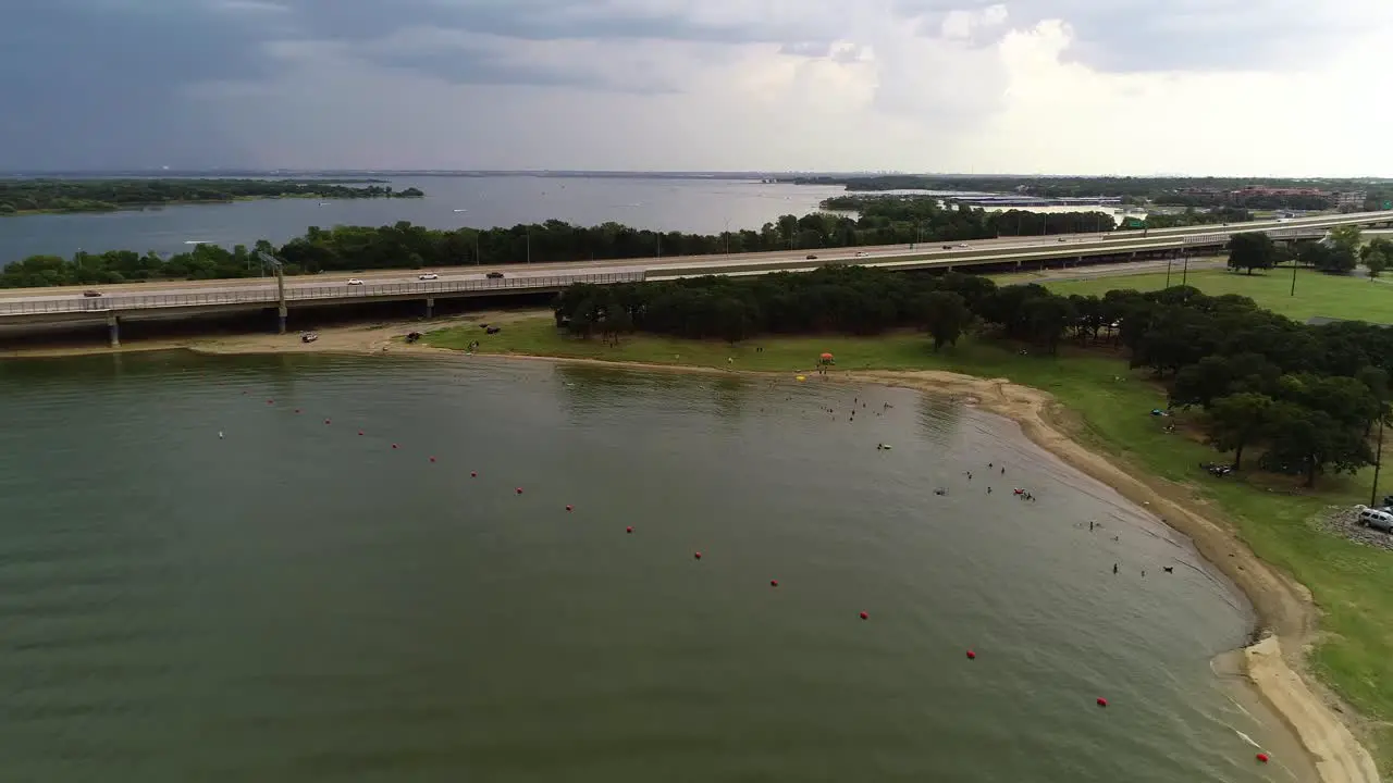 Aerial video of people swimming at Copperas Branch Park on Lake Lewisville in Lewisville Texas