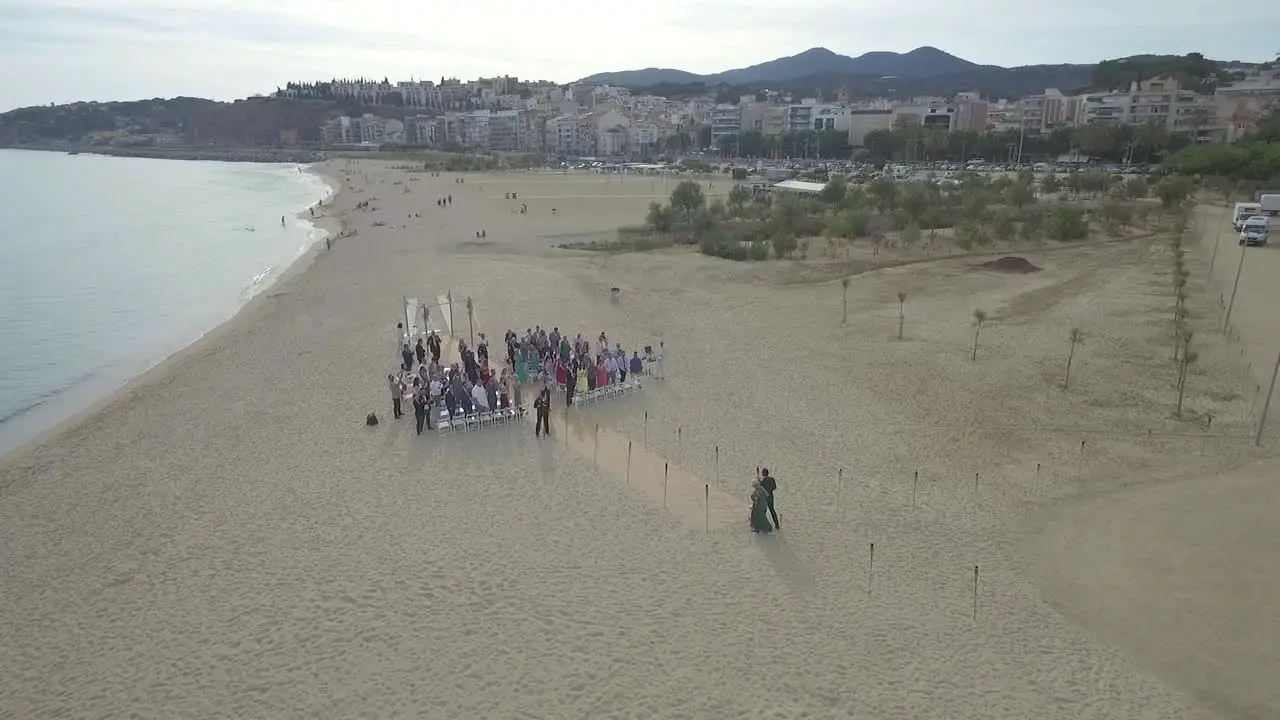 Couple Walking Down the Aisle at Beach Wedding Ceremony Aerial Circling