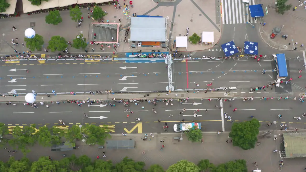 Overhead aerial shot of participants arriving at the finish line of a Marathon