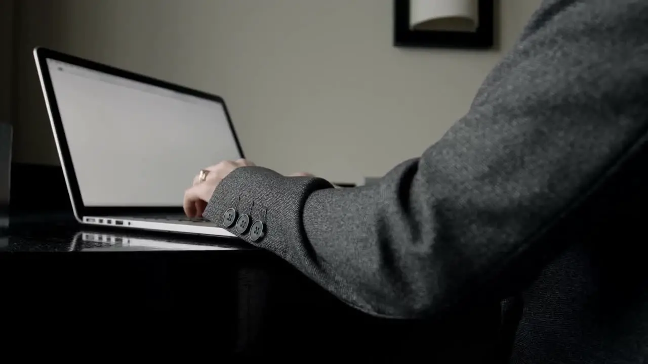 Mid section of businesswoman working on laptop in a modern hotel 4k