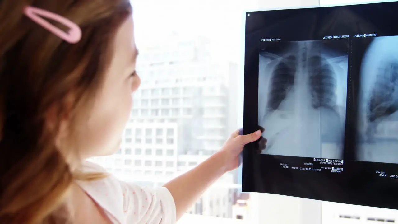 Girl examining x-ray