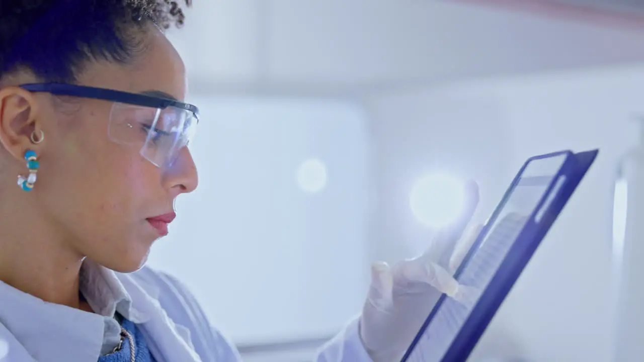 Woman scientist and tablet in medical research