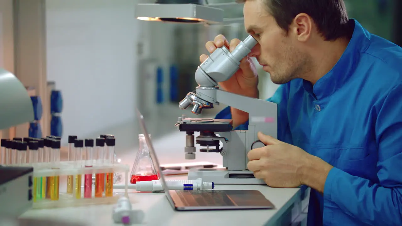 Scientist using microscope in laboratory Medical laboratory research