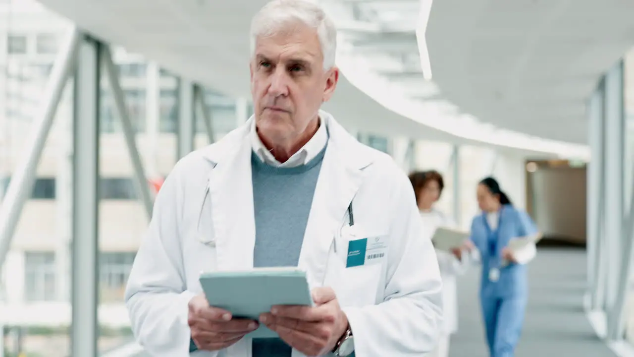 Doctor senior man and tablet for thinking