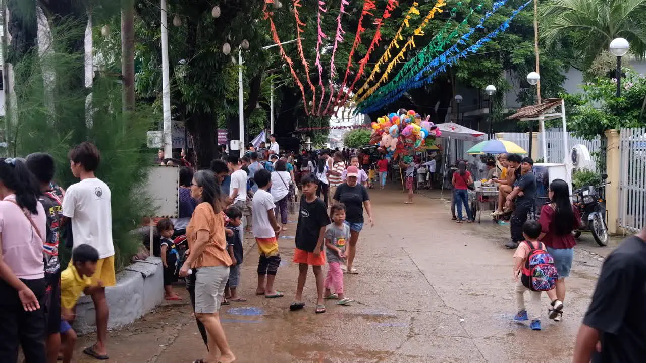 Crowds of Filipino people during Pintados Kasadyaan festival celebrations in Coron Town in Palawan Philippines Southeast Asia