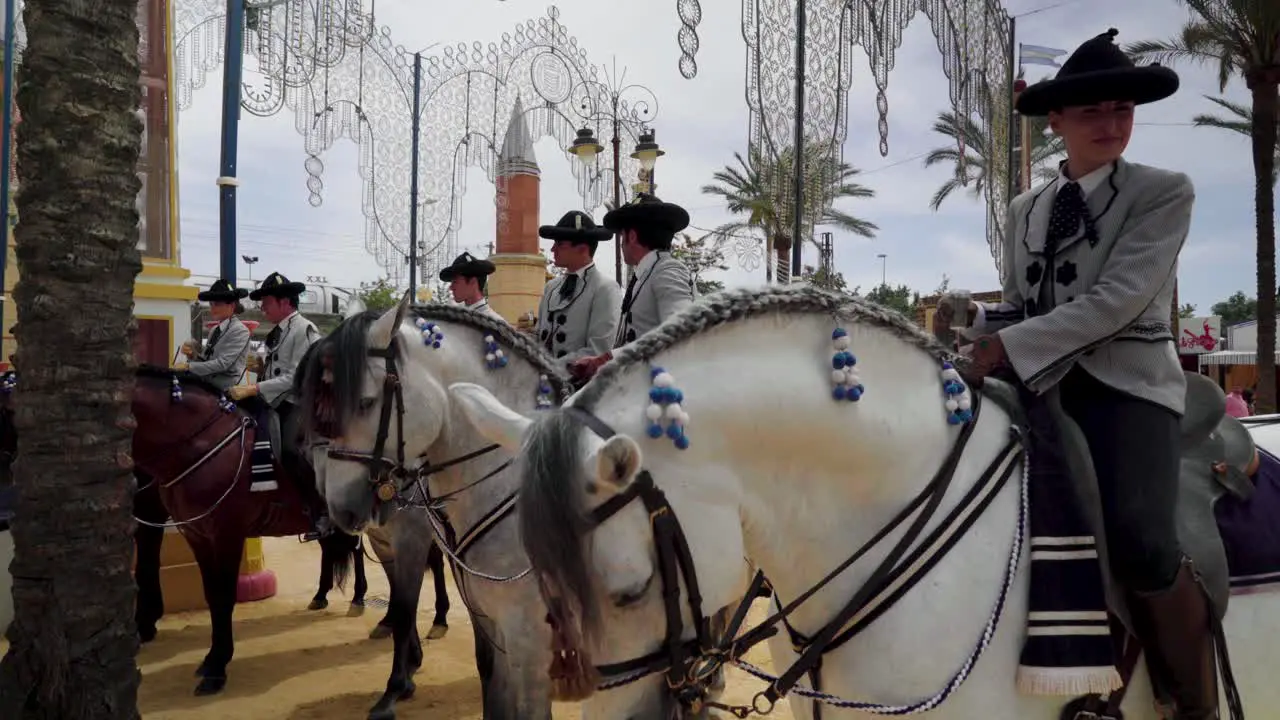 Jinete riders chat on horses at the fair in Jerez de la Frontera Spain